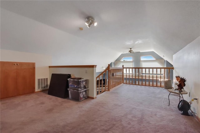 bonus room featuring vaulted ceiling, ceiling fan, and carpet floors