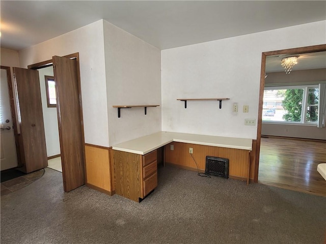 kitchen with dark carpet