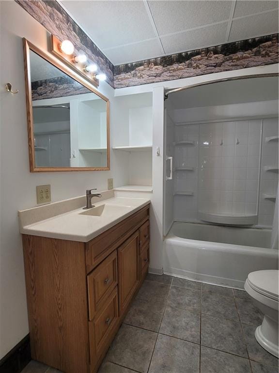 full bathroom with tile patterned floors, toilet, a paneled ceiling, shower / bath combination, and vanity