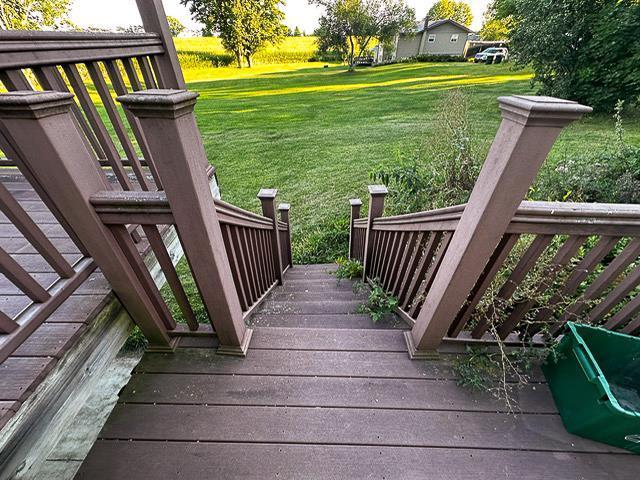 wooden terrace with a yard