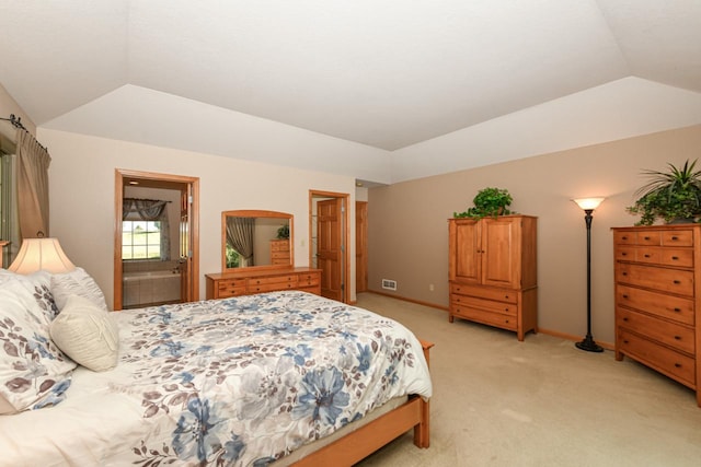 carpeted bedroom featuring vaulted ceiling