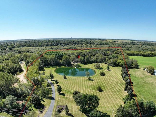 drone / aerial view with a water view and a rural view