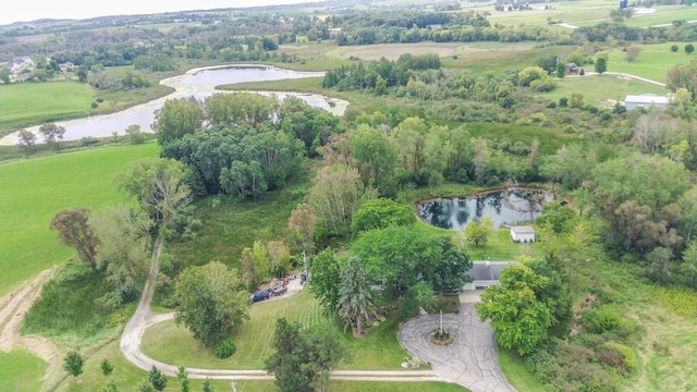 drone / aerial view featuring a water view and a rural view