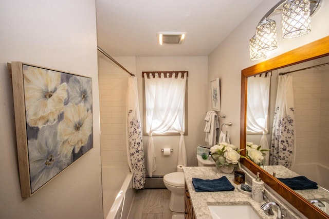 full bathroom with vanity, hardwood / wood-style floors, toilet, shower / bathtub combination with curtain, and baseboard heating