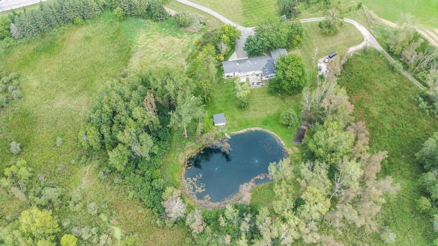 drone / aerial view featuring a water view and a rural view