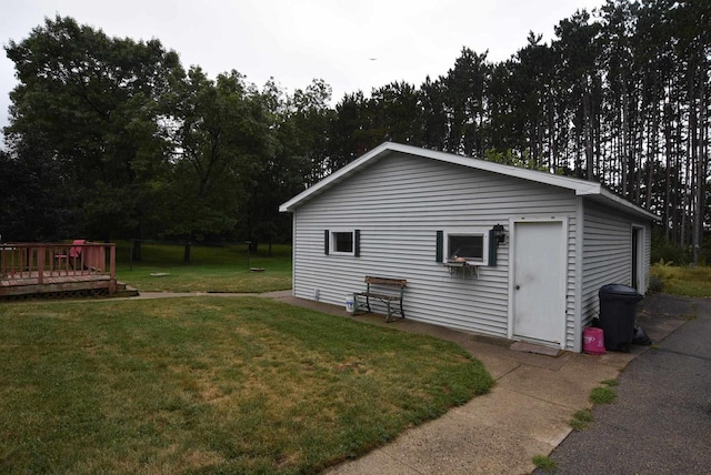 view of home's exterior featuring a yard and a deck