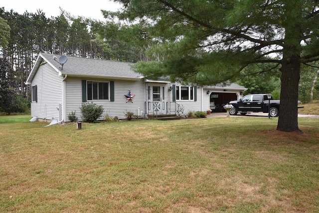 single story home with a front yard and a garage