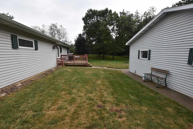 view of yard with a deck