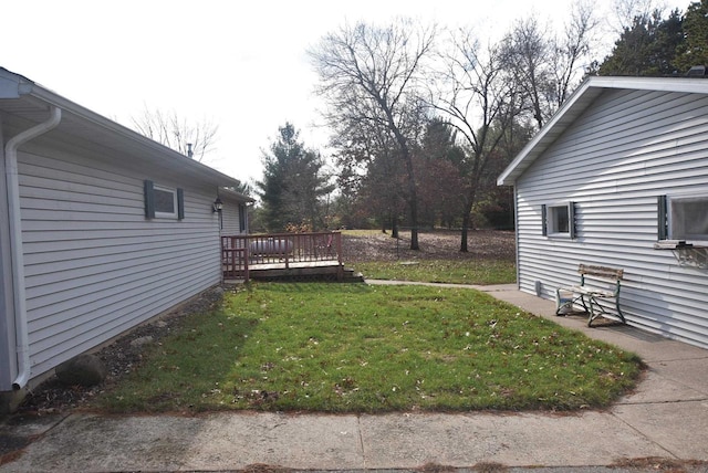 view of yard featuring a deck