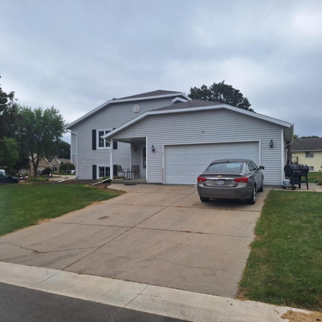 view of front of property with a garage and a front yard