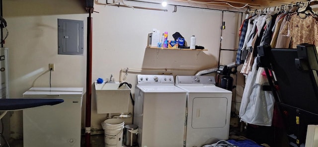 washroom with electric panel, sink, and washer and dryer