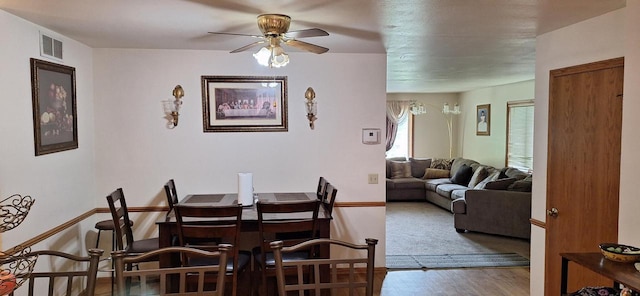 dining room featuring ceiling fan and carpet floors