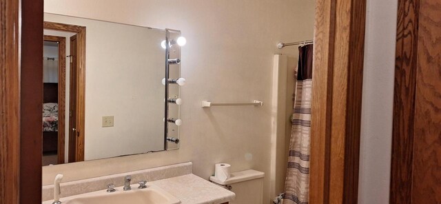 bathroom with vanity and curtained shower