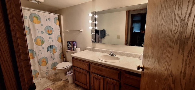 bathroom with vanity, toilet, and a shower with shower curtain