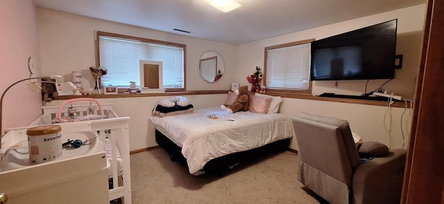 bedroom with light colored carpet