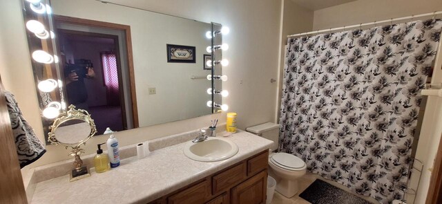 bathroom with vanity, toilet, and a shower with shower curtain