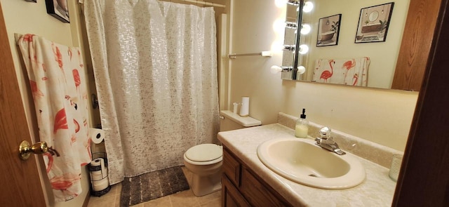 bathroom with tile patterned flooring, vanity, toilet, and a shower with shower curtain