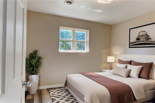 bedroom featuring wood-type flooring