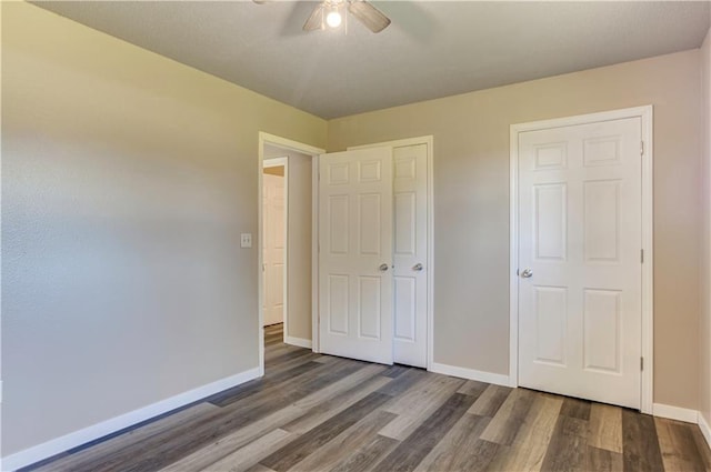 unfurnished bedroom featuring wood-type flooring and ceiling fan