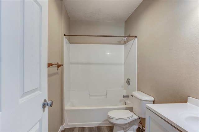 full bathroom featuring vanity, toilet, shower / washtub combination, and hardwood / wood-style flooring