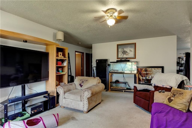 carpeted living room with a textured ceiling and ceiling fan