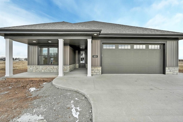 garage featuring concrete driveway