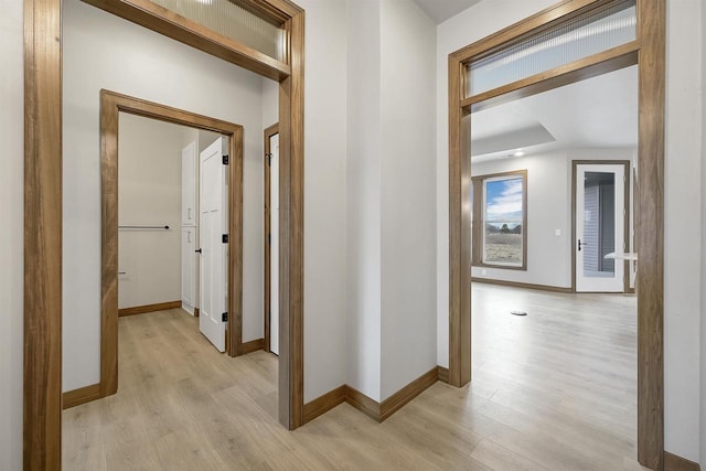 1630 N Honeysuckle Cir, De Pere, WI 54115 - hallway with baseboards and light wood-style flooring