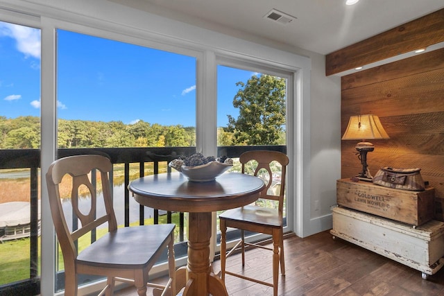 sunroom / solarium featuring a healthy amount of sunlight