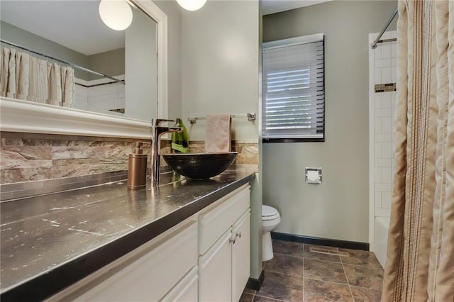 full bathroom with shower / bath combo, vanity, and toilet