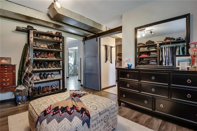 sitting room featuring hardwood / wood-style floors and a barn door