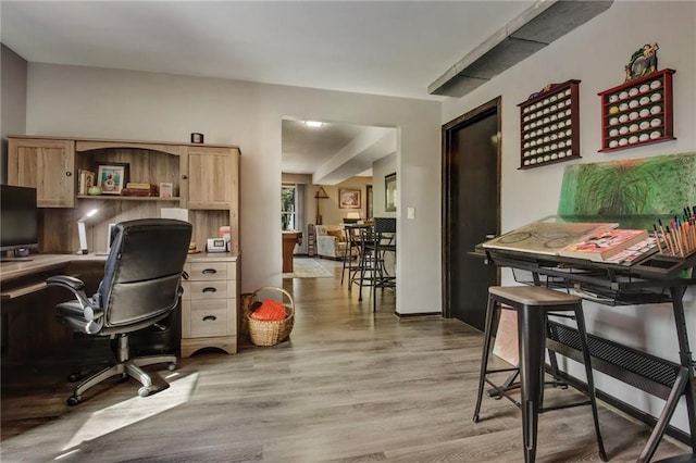 office with light hardwood / wood-style flooring