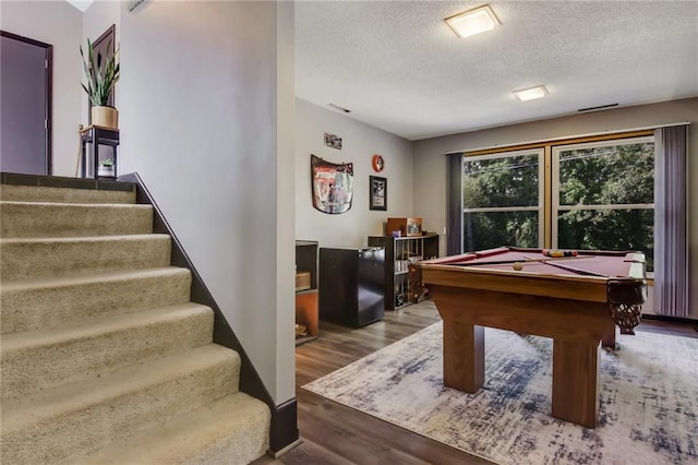 playroom with hardwood / wood-style flooring, billiards, and a textured ceiling