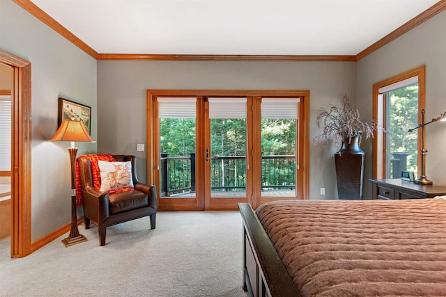 carpeted bedroom featuring ornamental molding, multiple windows, and access to exterior