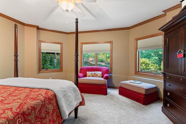 bedroom featuring crown molding, ceiling fan, and light carpet