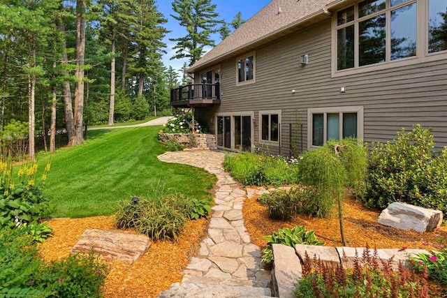 view of yard with a balcony