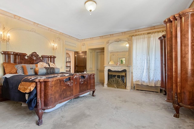 carpeted bedroom featuring a premium fireplace