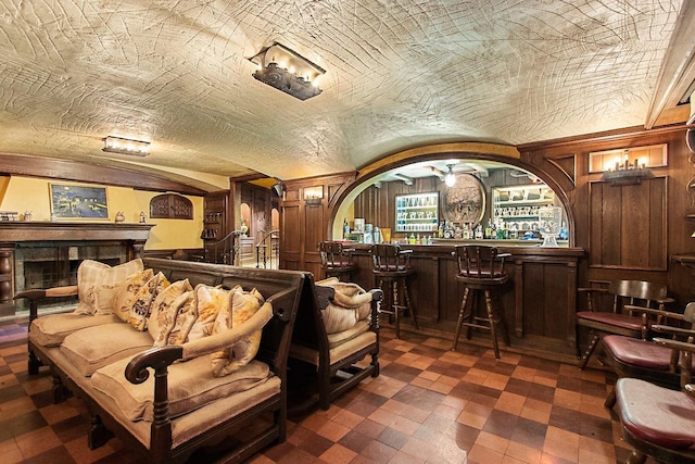 interior space with wood walls and bar