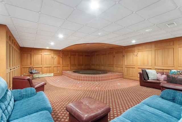 game room featuring light colored carpet, baseboard heating, and a paneled ceiling