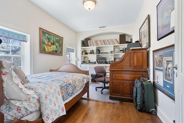 bedroom featuring wood-type flooring