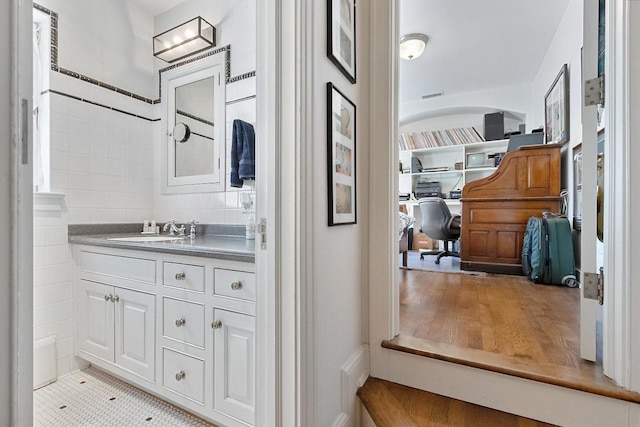 bathroom featuring tile patterned flooring and vanity