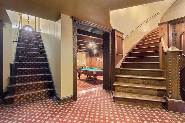 stairway featuring billiards and carpet flooring