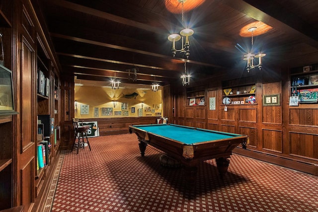 game room with bar area, pool table, built in shelves, dark carpet, and wood walls