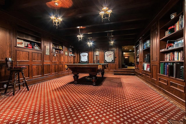 playroom with built in features, pool table, wooden walls, and carpet