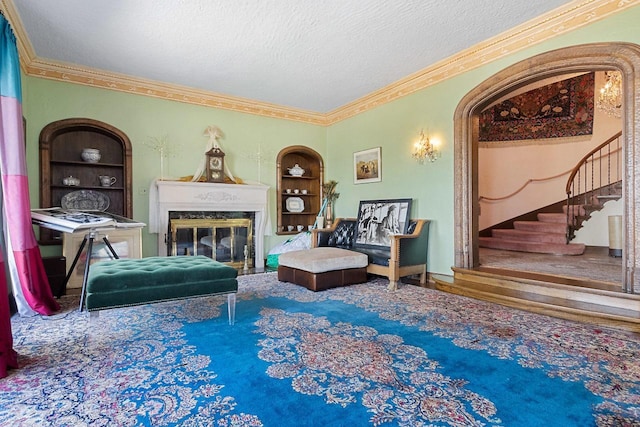 living area featuring a textured ceiling, a premium fireplace, and carpet floors