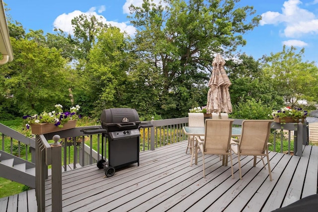 wooden deck with a grill