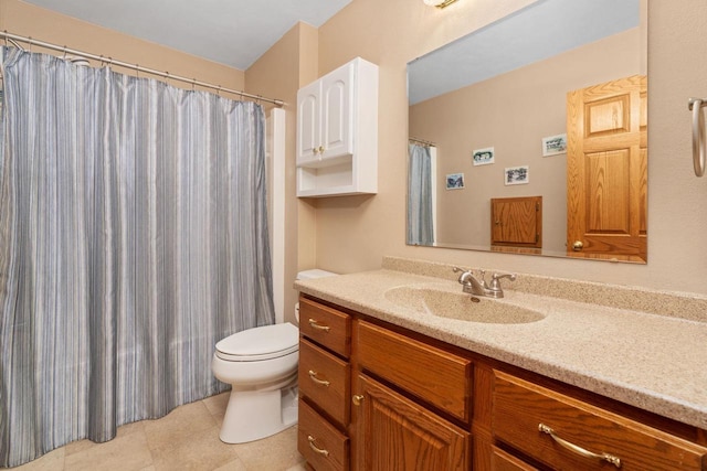 bathroom with tile patterned floors, vanity, and toilet