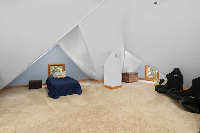 carpeted bedroom featuring vaulted ceiling