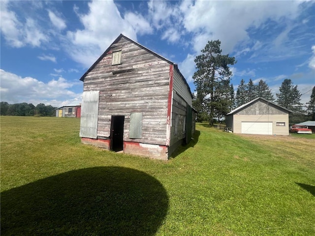 view of outdoor structure with a lawn