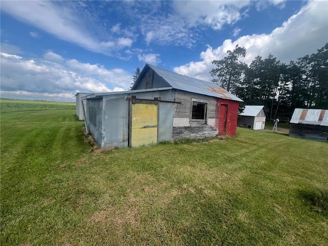 view of outdoor structure featuring a yard