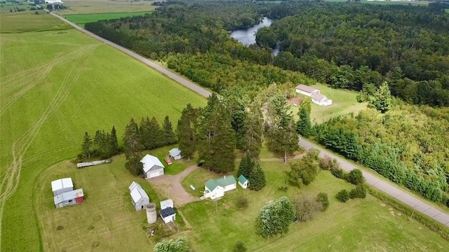 birds eye view of property featuring a rural view and a water view